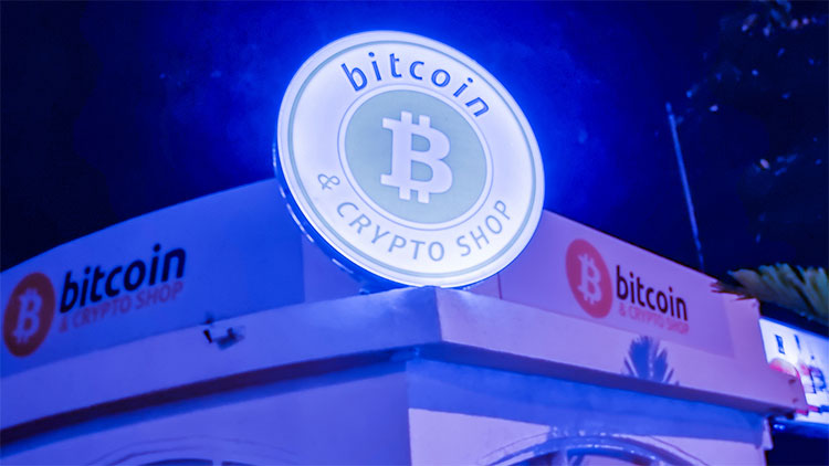Image of blue light up sign for bitcoin & crypto shop