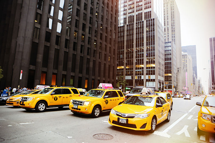 3 taxi cabs in a row