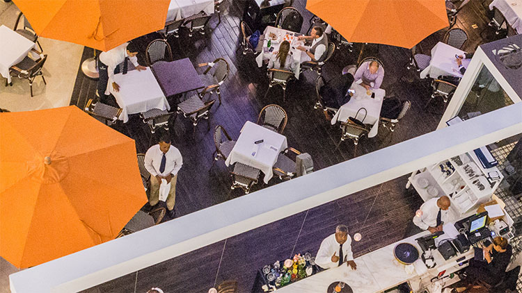 Picture of people and servers in restaurant
