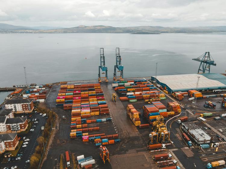 An Aerial Photography of Cargo Containers Near the Ocean